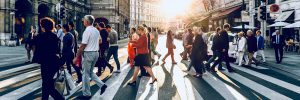 Many people cross a street